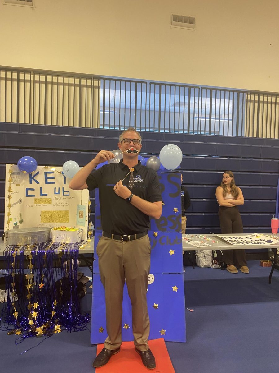 Mr. V participating at one of the club tables. 